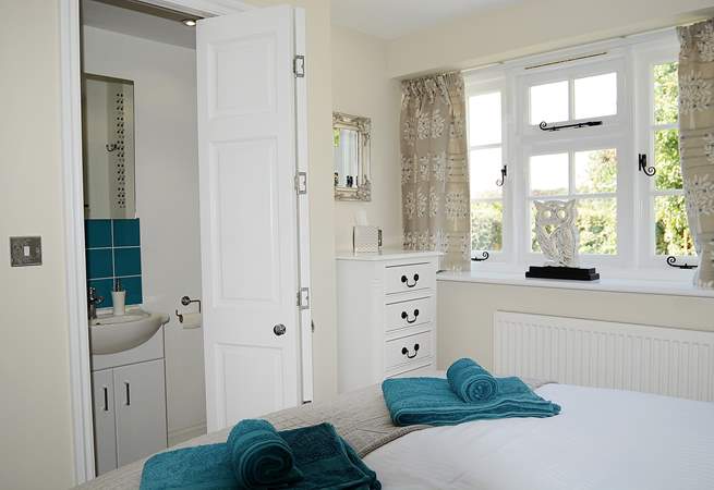 A folding door leads from the bedroom to the shower-room.