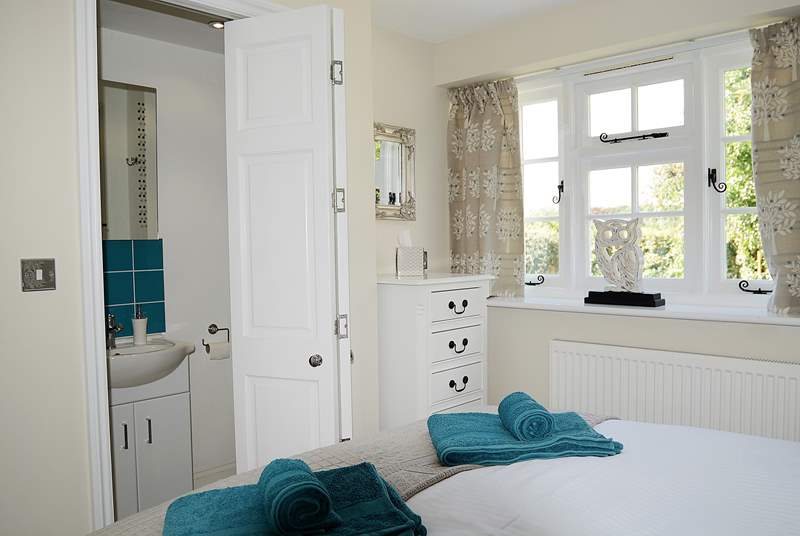 A folding door leads from the bedroom to the shower-room.