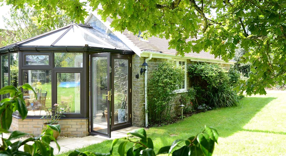 Owl's Nest Cottage nestles into the owner's mature garden.