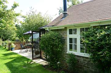 Owl's Nest Cottage is compact and built of local stone, with a sunny conservatory at the far end.