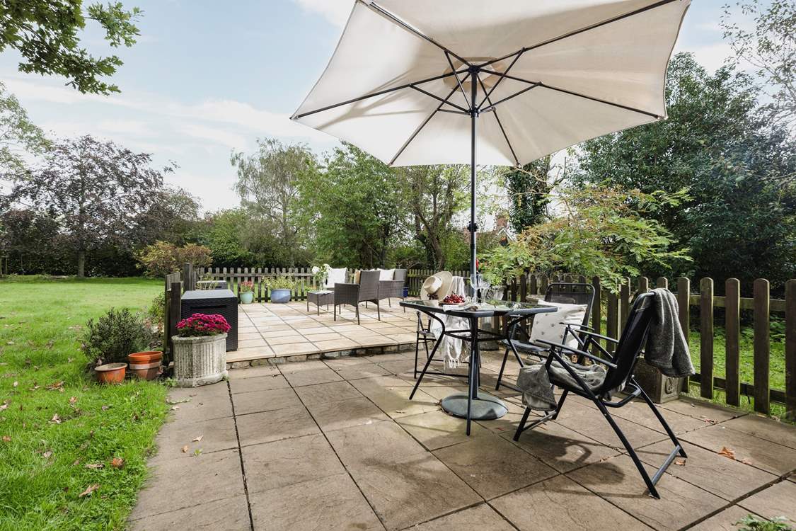 Owl's Nest Cottage is compact with a bright conservatory and pretty patio.