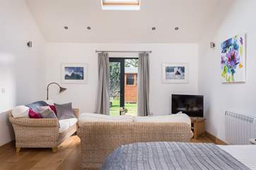 French doors open out to the fully enclosed, private garden.