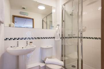 The shower-room has a large cubicle and power shower.