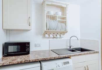 A handy separate utility room has a washer/dryer and dishwasher.