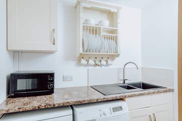 A handy separate utility room has a washer/dryer and dishwasher.