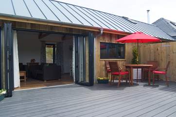 The doors open back fully for seamless indoor/outdoor living on warm days.