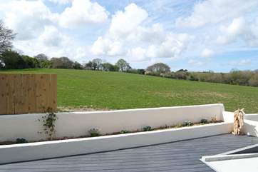 The deck looks out over fields.