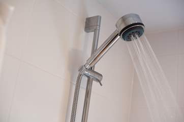 The shower has an adjustable head.
