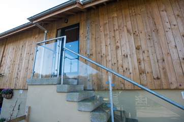 Steps lead up to the front door but the cottage can also be accessed via the ramp at the rear.