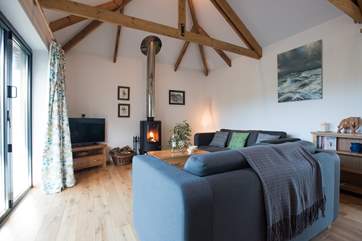 Bi-fold doors open out from the living space.
