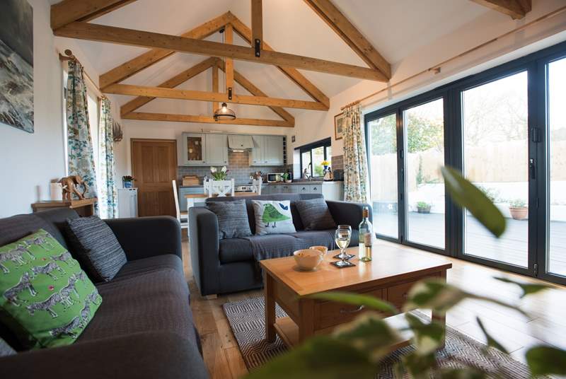 Big bi-fold doors open the room right up to the sheltered deck area.