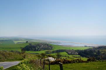 The spectacular coastline with Chesil Beach and the Isle of Portland in the distance. Take a drive along the Jurassic Coast road from Weymouth to Bridport for truly spectacular views in both direction