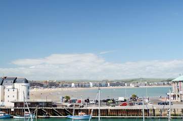 Weymouth's safe and sandy beach, with the harbour in the foreground.