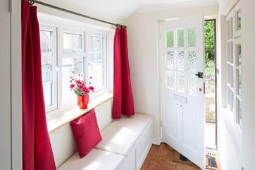 The light and airy front porch, an ideal place to read.