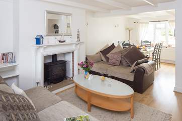 The open plan sitting/dining-room is a lovely sociable space with dual-aspect windows.
