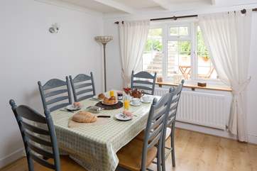 There is plenty of room at the dining-room table for all the family to dine or play one of the games provided at September Cottage.
