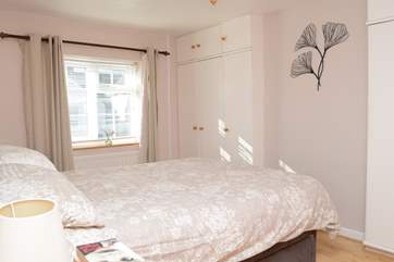 The master bedroom has a 5' bed, fitted wardrobes give a spacious feel, the window looks out to the front of the cottage.