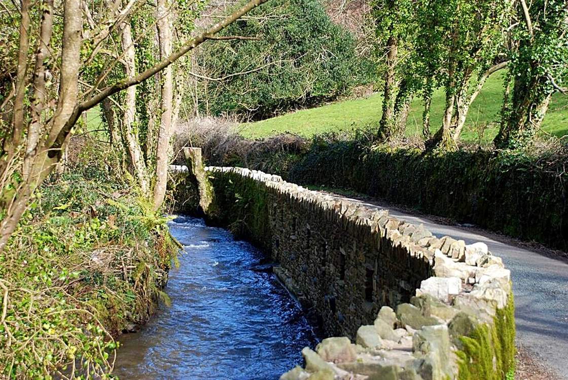 A little stream runs alongside the lane down to the cottage.