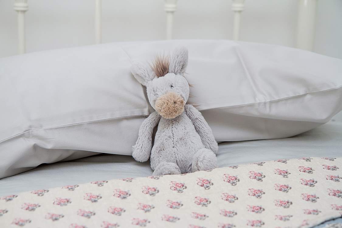 A cuddly toy in the twin bedroom.