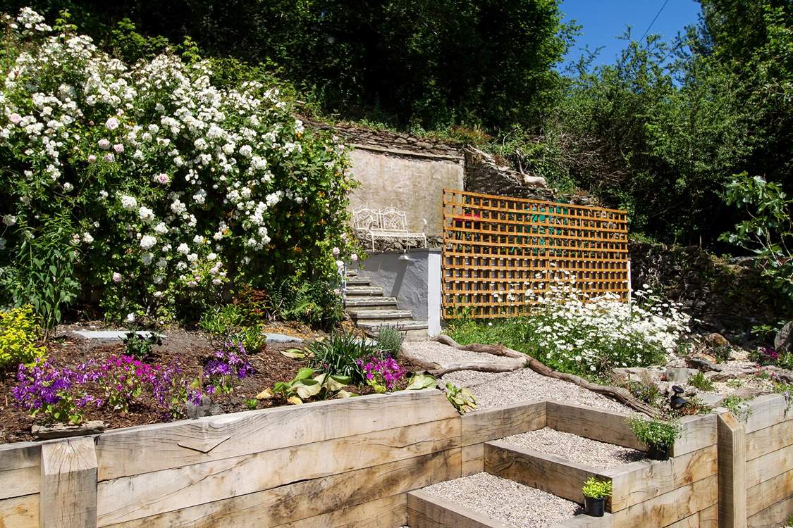 Gravel steps up to the top terrace.