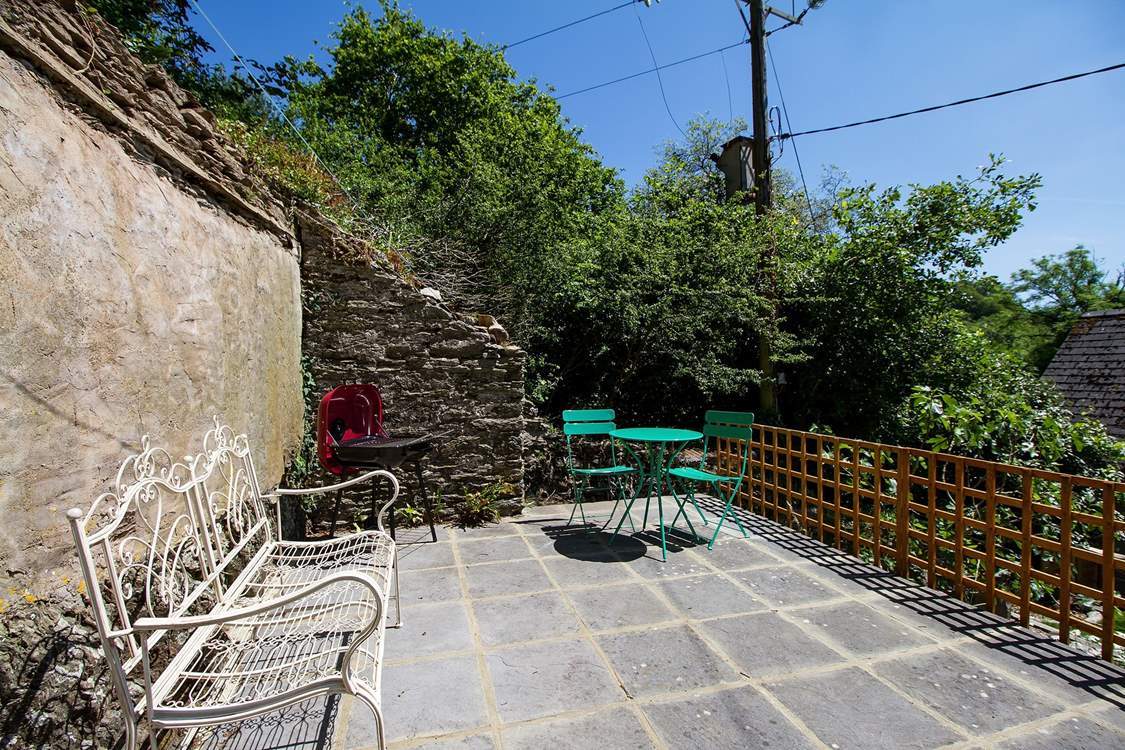 The barbecue is on the top terrace.