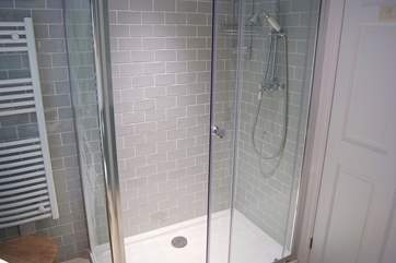 There is a small step up from the hall into the shower-room.