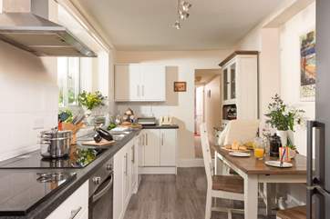 Prepare holiday feasts. There is a step leading down into the kitchen.