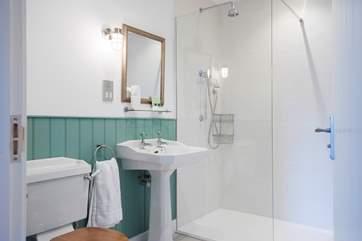 Beautiful bathrooms with fluffy towels and soft white robes are awaiting you.