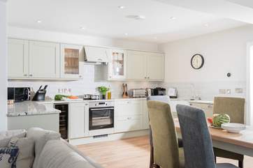The open plan living-room is light, spacious, beautifully furnished and very well-equipped.