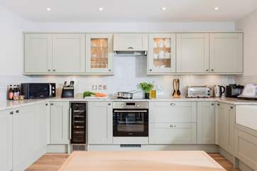 This very stylish kitchen is well-equipped with the latest appliances and the thoughtful Owners have even included a wine cooler.