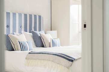 Quality beds, crisp white linens and gorgeous soft furnishings can be found throughout this super apartment.