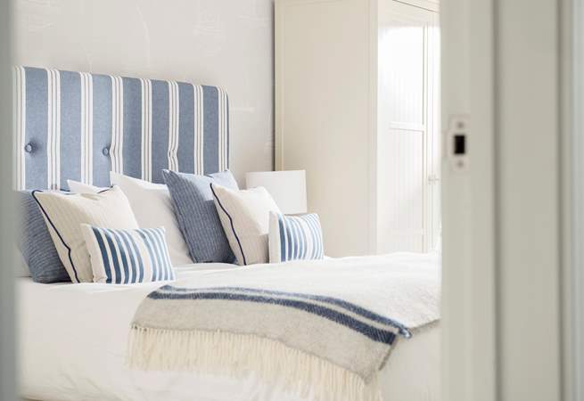 Quality beds, crisp white linens and gorgeous soft furnishings can be found throughout this super apartment.