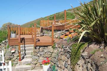 Steps lead up to the raised decking behind the apartments, the lower deck is shared but the top deck is all for you.