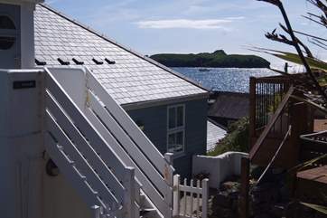 The steps leading up to the front door and steps on the right leading to your terrace.