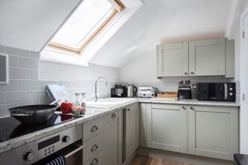 The small but well-equipped and good looking kitchen is just off the sitting-room.