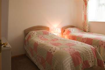 The twin bedroom with two single beds, is at the rear of the apartment.