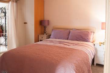The double bedroom with a 5ft double bed and has a doorway into the sitting-room and another entrance to the front sitting-area.