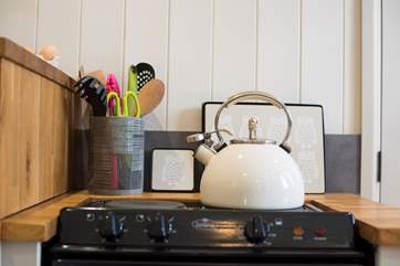 There is a little mini-oven with two ring hob for cooking.