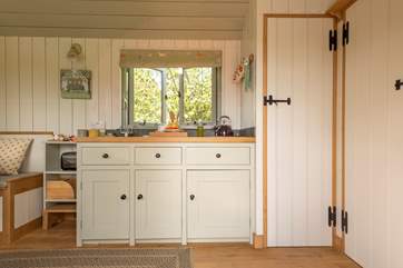 The kitchen includes a small fridge and double hob as well as an electric toaster too.