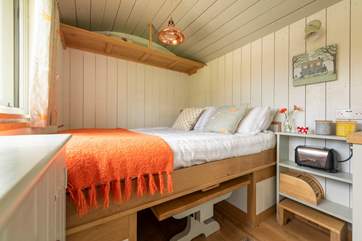 The dining-area cleverly and very easily converts into the double bed, duvet, pillows and all.