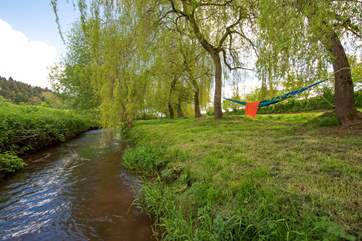 The views by the river are gorgeous too. There are plenty of spots for a picnic or relax in the hammock provided.