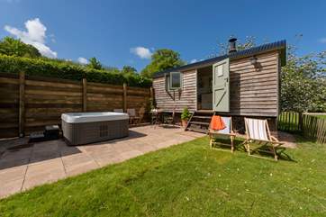 Set in a beautiful meadow alongside a tree-lined river.