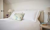 Luxurious soft furnishings and bedding add to the experience here. - Thumbnail Image