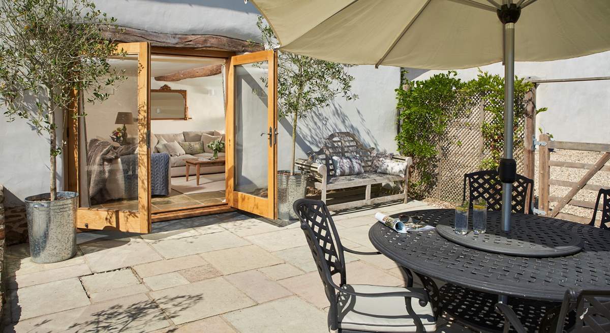 The living-room has fabulous French windows out onto the patio - with that great view beyond.