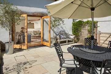 The living-room has fabulous French windows out onto the patio - with that great view beyond.