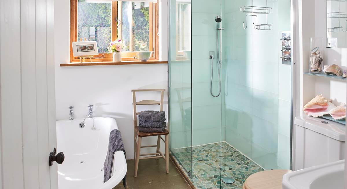 The downstairs bathroom has been beautifully designed, with a lovely deep bath as well as a walk-in shower.