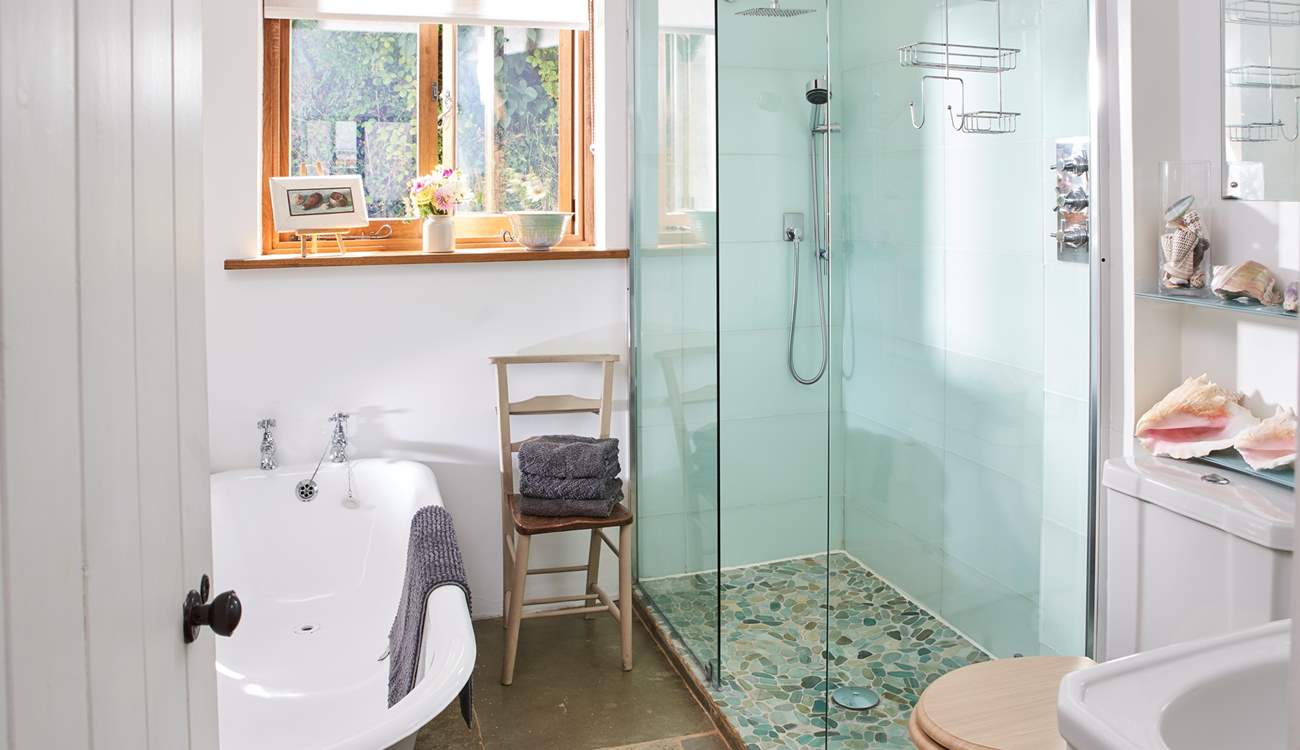 The downstairs bathroom has been beautifully designed, with a lovely deep bath as well as a walk-in shower.