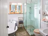 The downstairs bathroom has been beautifully designed, with a lovely deep bath as well as a walk-in shower.