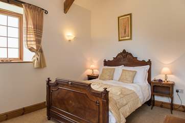 The antique French bedstead really adds a touch of romance to Bedroom 1.
