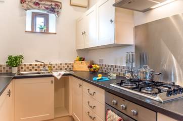 The galley-kitchen has all that you need to cook up a treat.